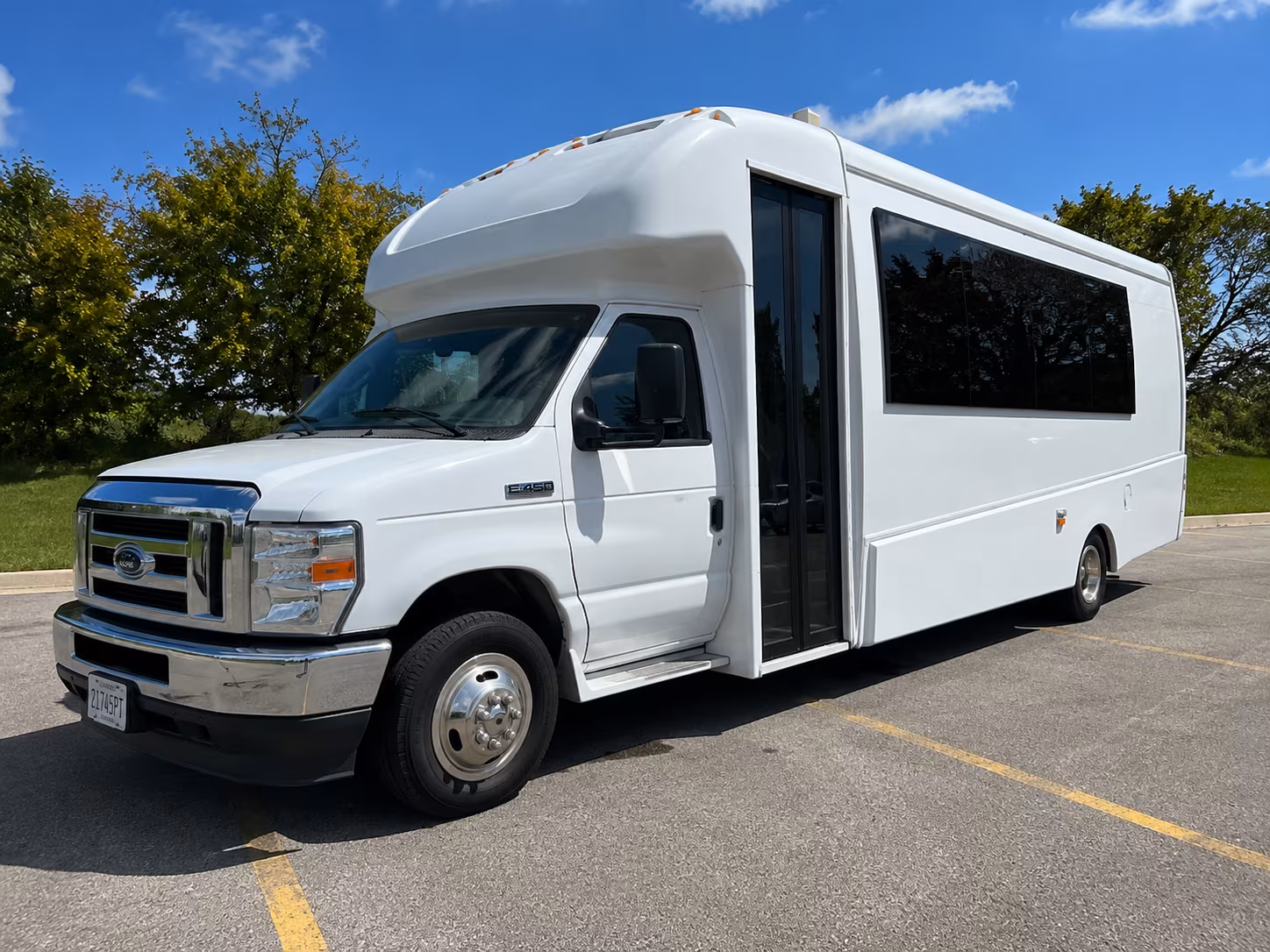 Group beside a Mercedes Sprinter limo in Detroit
