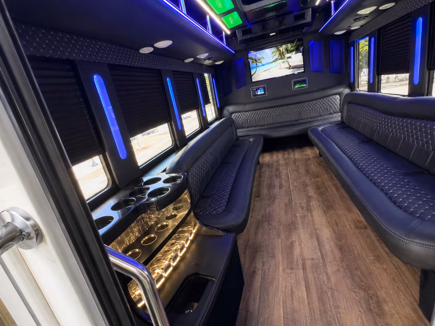Wedding guests seated inside a party bus serving Detroit