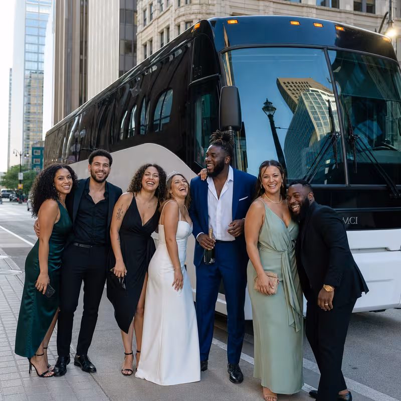 Passengers loading luggage while boarding an Detroit group shuttle