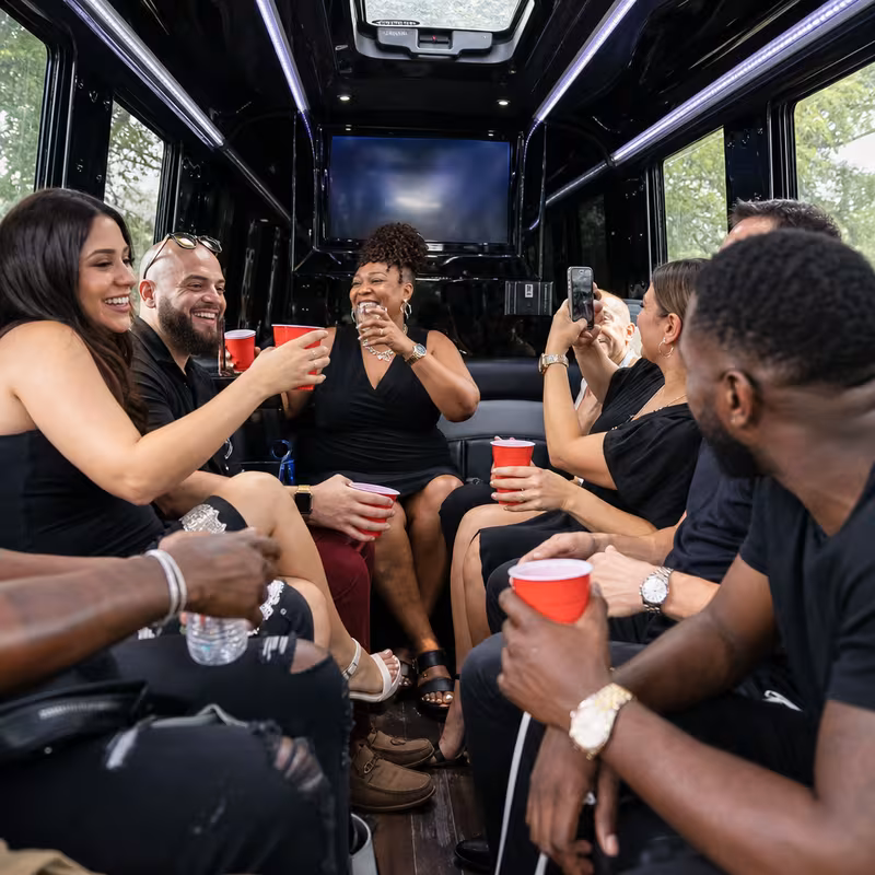 Black Mercedes Sprinter van staged for an Detroit Birthday Transportation group