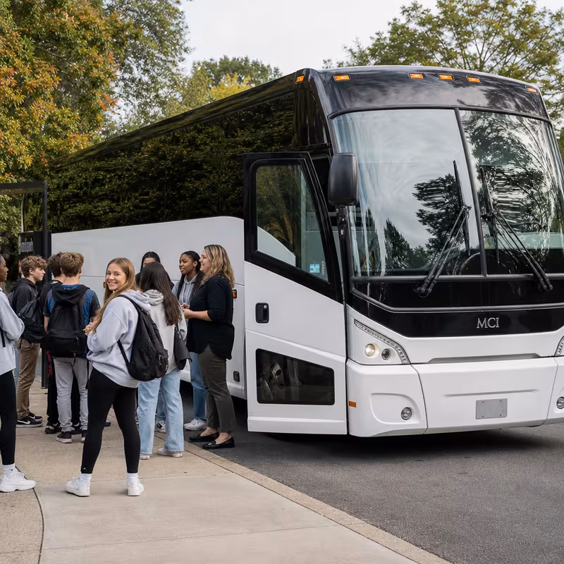 Black Mercedes Sprinter van staged for an Detroit School Transportation group
