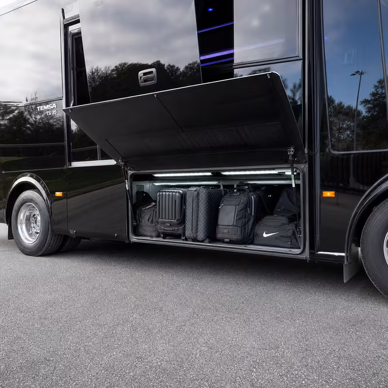 Party bus interior with wraparound leather seating and LED lighting in Detroit