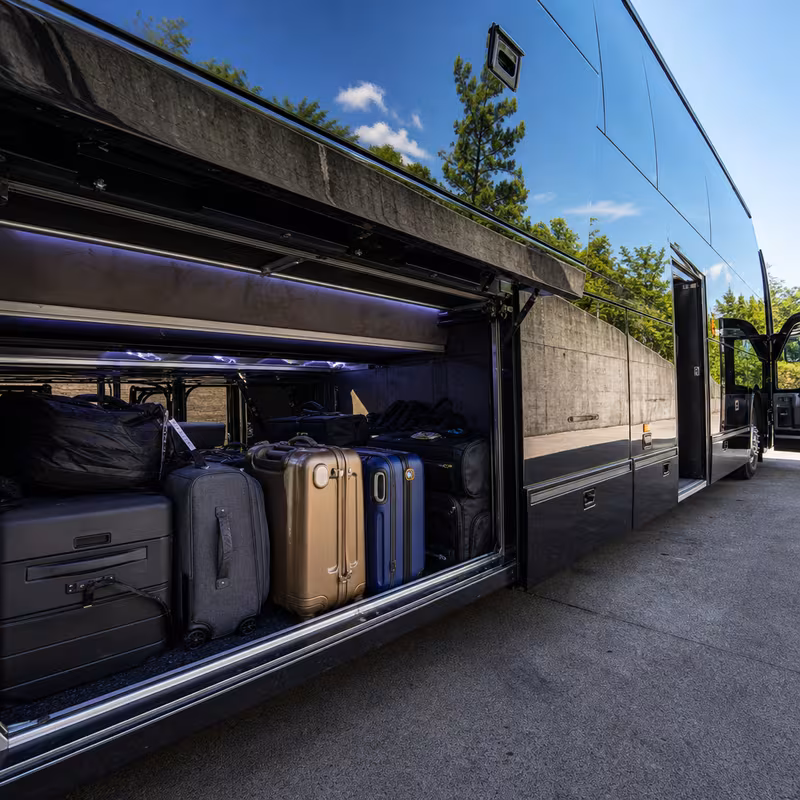 Party bus interior with wraparound leather seating and LED lighting in Detroit