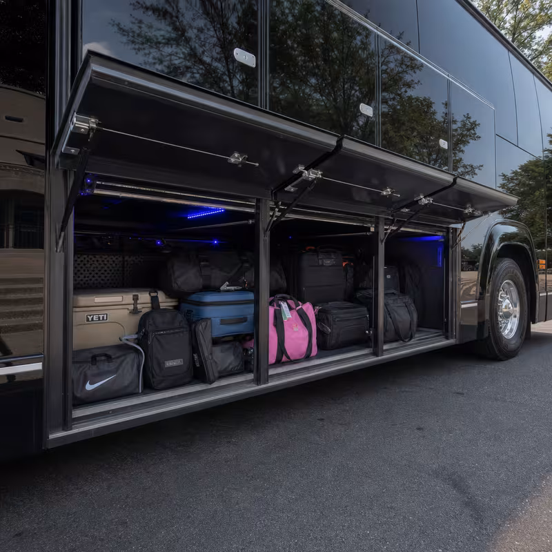 Party bus interior with wraparound leather seating and LED lighting in Detroit